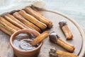 Churros - famous Spanish dessert with chocolate sauce Royalty Free Stock Photo