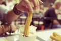 Churros and hot chocolate topped with whipped cream