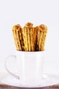 churros in a mug, traditional fried sweet from Latin America, Brazil, Colombia, United States and Portugal, served with or without