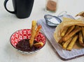 Churros, sweet fried fried choux pastry dough, sprinkled with sugar and ground cinnamon. Served with chocolate sauce. Traditional