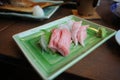 Chutoro and Otoro Sashimi on a green plate Is a premium Royalty Free Stock Photo