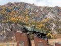 Chuysky tract, Altai Republic, Russia - 15 October 2020: Autumn view of the Altai mountains and the monument to driver Kolka Royalty Free Stock Photo