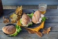 Ciabatta baguette sandwiches with ham, cheese, lettuce and a glass of beer Royalty Free Stock Photo