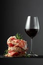 Ciabatta with prosciutto, rosemary and glass of red wine Royalty Free Stock Photo