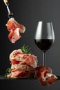 Ciabatta with prosciutto, rosemary and glass of red wine Royalty Free Stock Photo