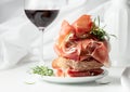 Ciabatta with prosciutto, rosemary and glass of red wine Royalty Free Stock Photo