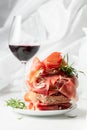 Ciabatta with prosciutto, rosemary and glass of red wine Royalty Free Stock Photo