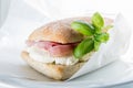 Ciabatta with prosciutto slices and mozzarella ready to eat