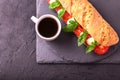 Ciabatta sandwich with caprese salad with coffee. Royalty Free Stock Photo