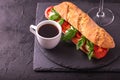 Ciabatta sandwich with caprese salad with wine and coffee. Royalty Free Stock Photo