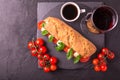 Ciabatta sandwich with caprese salad with wine and coffee. Royalty Free Stock Photo