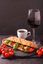 Ciabatta sandwich with caprese salad with wine and coffee. Royalty Free Stock Photo