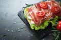 Ciabatta sandwich with salad leaves jamon serrano mozzarella Royalty Free Stock Photo