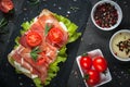 Ciabatta sandwich with salad leaves jamon serrano mozzarella Royalty Free Stock Photo