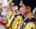 Group portrait of young Asian women wearing traditional minangkabau ethnic costume lined up in wedding ceremony