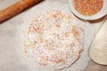 The ciaramicola is a typical Umbrian Easter cake; it is a donut-shaped cake, red in color with white icing and colored topping spr Royalty Free Stock Photo