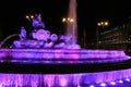 Cibeles fountain illuminated in purple for Women's Day Royalty Free Stock Photo