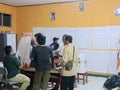 Cibinong 14 February 2024, several people are counting election ballot papers in a school room