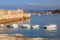 Ciboure, France - Sept 26, 2016: Fortification of the old marina of ciboure with a few walkers. There is pleasure boat in the fore