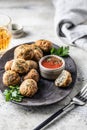 Cibriki potato fritters made from grated potatoes in balls form. Traditional Belarusian cuisine, served with sauce