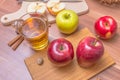 Cider - alcohol hot apple drink and apples on wooden table Royalty Free Stock Photo