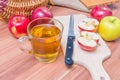 Cider - alcohol hot apple drink and apples on wooden table Royalty Free Stock Photo