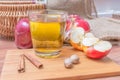 Cider - alcohol hot apple drink and apples on wooden table