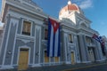 Cienfuegos, cuba. City Hall with cuban and part Flags on facade during celebration of 1 january.