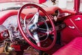 CIENFUEGOS, CUBA - MARCH 11, 2018 Red Chevrolet 350 fitfyfive - 1955 Chevy Nomad Restomod. View of the dashboard with steering whe Royalty Free Stock Photo