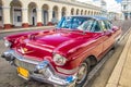 Cienfuegos , CUBA - 22 MARCH 2012 : Red Old retro Car on authentic streets Cuba Cienfuegos Royalty Free Stock Photo