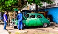 Cienfuegos, Cuba - 2019. Mechanic fixing an old classic american car