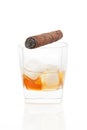 Cigar and whiskey with ice. Royalty Free Stock Photo