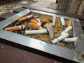 Cigarette ash and butts Royalty Free Stock Photo