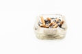 A cigarette with ash end rests Royalty Free Stock Photo