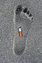 Cigarette in a foot trace