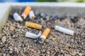 Cigarette butts in an ashtray Royalty Free Stock Photo