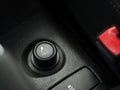 Cigarette lighter and power socket inside the vehicle. cigarette sign black and white photo with red seat belts Royalty Free Stock Photo