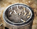 Cigarette in sand ashtray bin Royalty Free Stock Photo