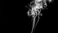 Cigarette smoke isolated on dark background Royalty Free Stock Photo