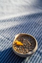Cigarette stub in sand bucket ashtray
