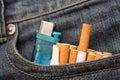 Cigarettes and lighter in pocket of jeans Royalty Free Stock Photo