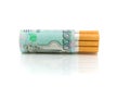 Cigarettes and money on a white background close-up Royalty Free Stock Photo