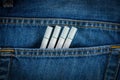 Cigarettes in old blue denim jeans pocket Royalty Free Stock Photo