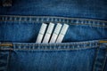 Cigarettes in old blue denim jeans pocket Royalty Free Stock Photo