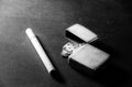 Cigarettes with old metal lighter Royalty Free Stock Photo