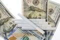 Cigarettes on top of dollars Royalty Free Stock Photo