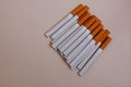 Cigarettes on a white background. Yellow filter. Harm to health. It's a bad habit. The vision of a world without Royalty Free Stock Photo