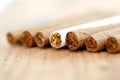 Cigarillo in a wood background Royalty Free Stock Photo
