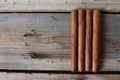 Cigars and cognac on an old wooden table Royalty Free Stock Photo