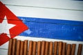 Cigars on painted Cuban national flag Royalty Free Stock Photo